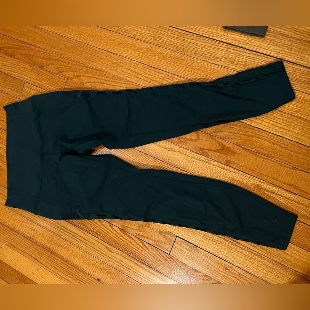 Lululemon turquoise leggings with mesh cross cross details